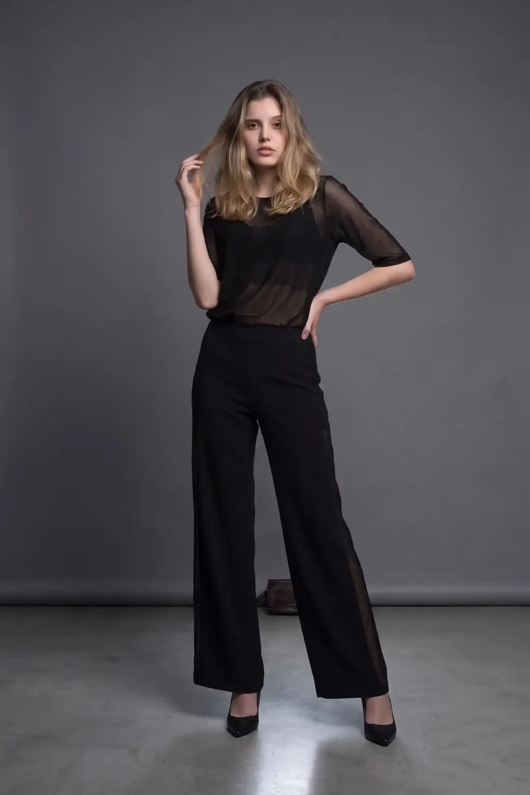 The same woman in her real clothes